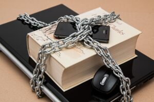 A book wrapped in metal chains symbolizing cybersecurity and data protection.